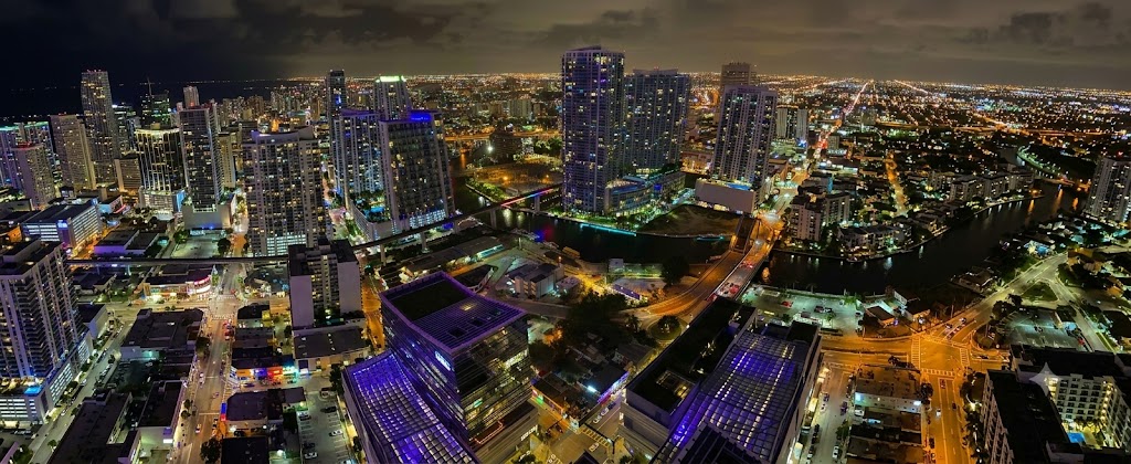 Aerial view of Miami at night — Florida's busiest rideshare market, where Uber and Lyft accidents raise complex insurance coverage questions